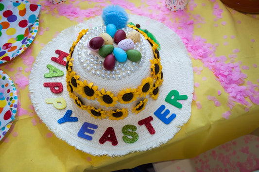 blue and white round cake with blue and red sprinkles