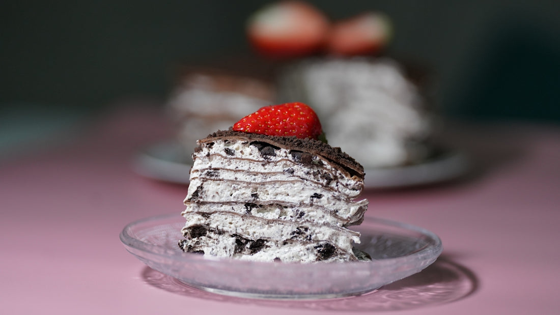 a stack of chocolate cake with a strawberry on top