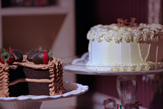 a close up of two cakes on a plate